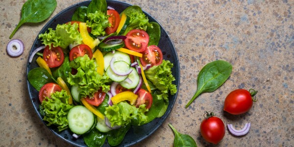 Cucumbers, cherry tomatoes, spinach, lettuce, onion and yellow pepper