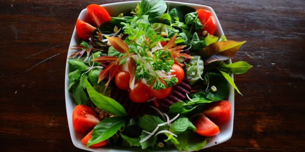 Green salad, cherry tomatoes, red beets and cucumbers