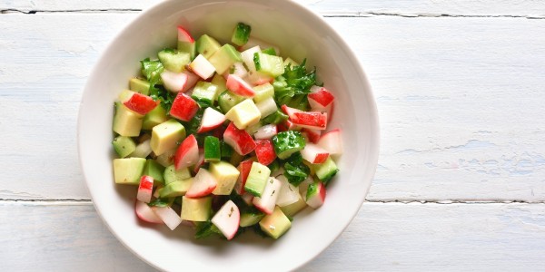 Avocado, radishes, cucumbers and green salad