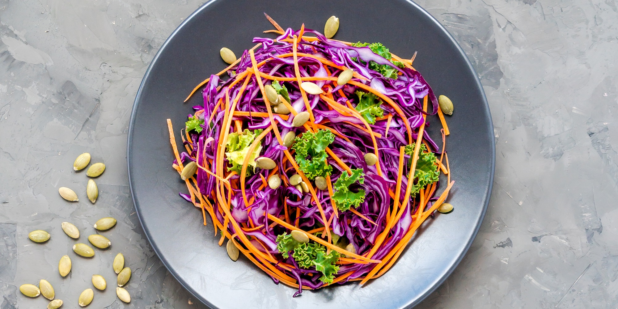 Kale, purple cabbage, carrots and pine seeds